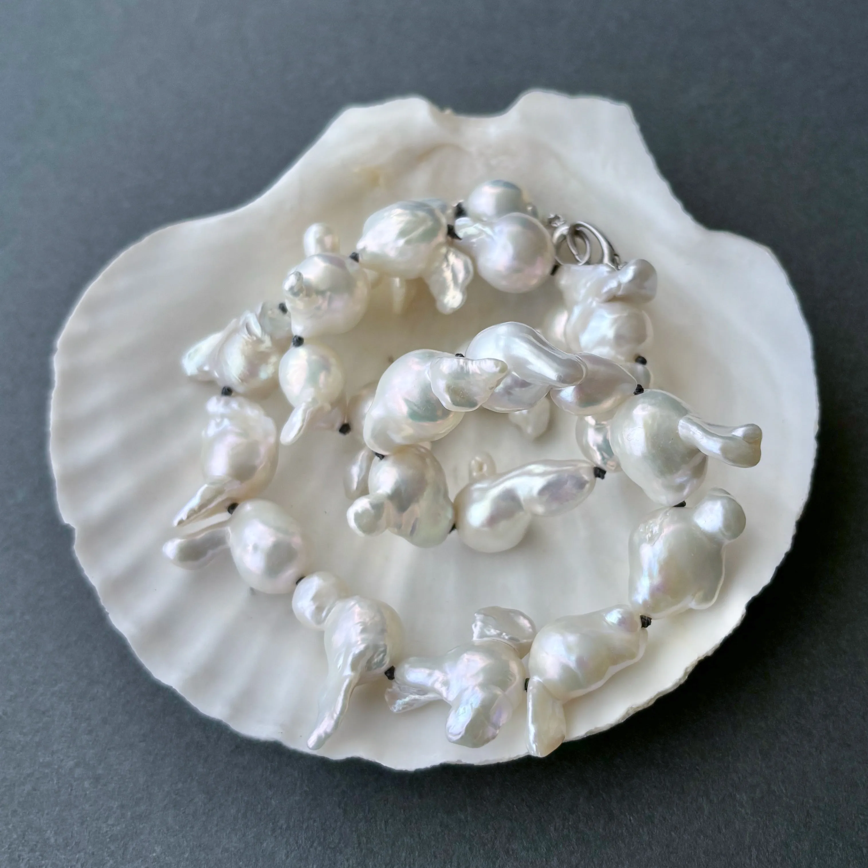 funky white freshwater pearls on dark grey knots