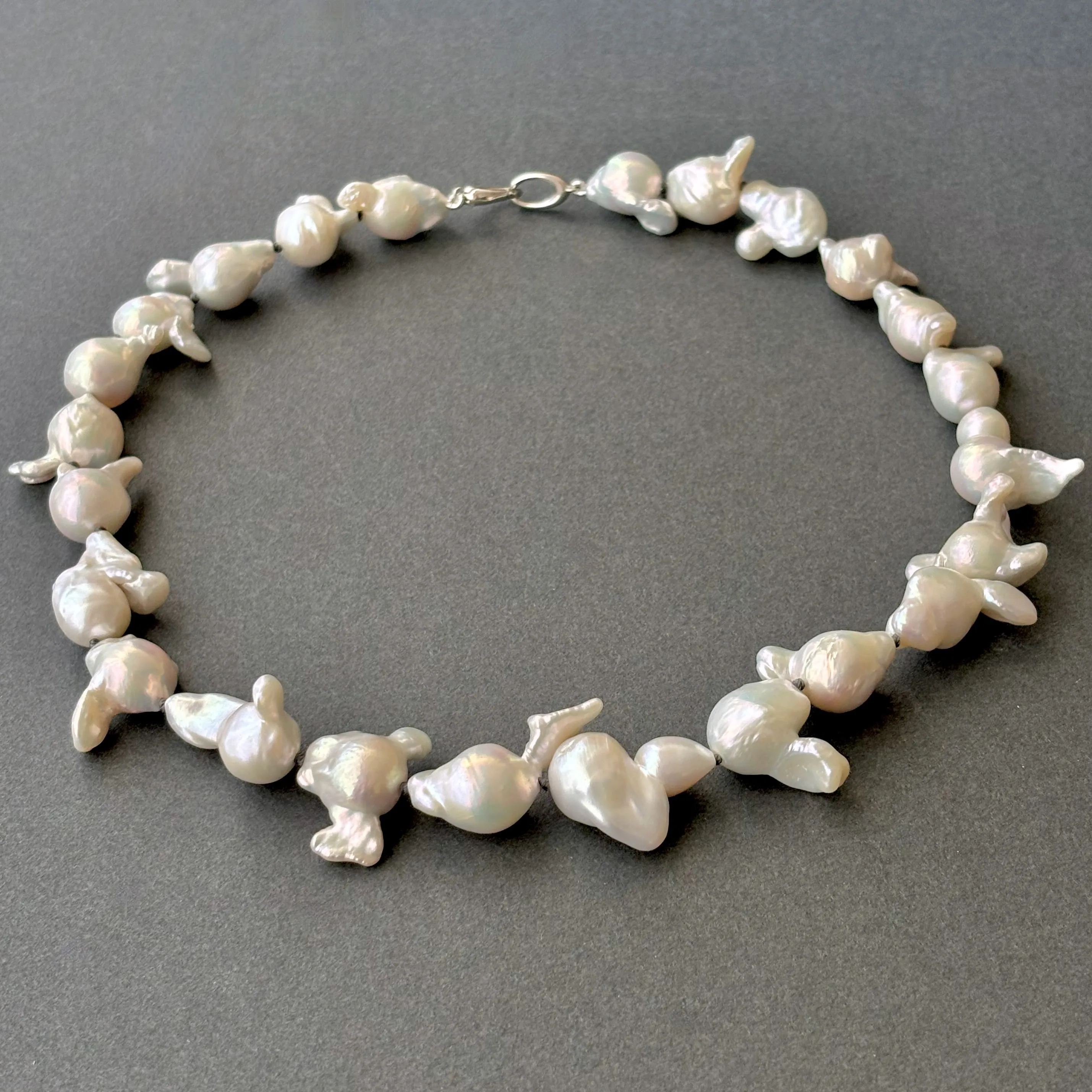 funky white freshwater pearls on dark grey knots